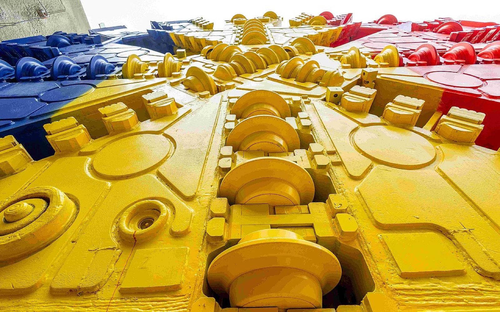 Cutterhead of a tunnel boring machine painted in the colours of the Romanian flag