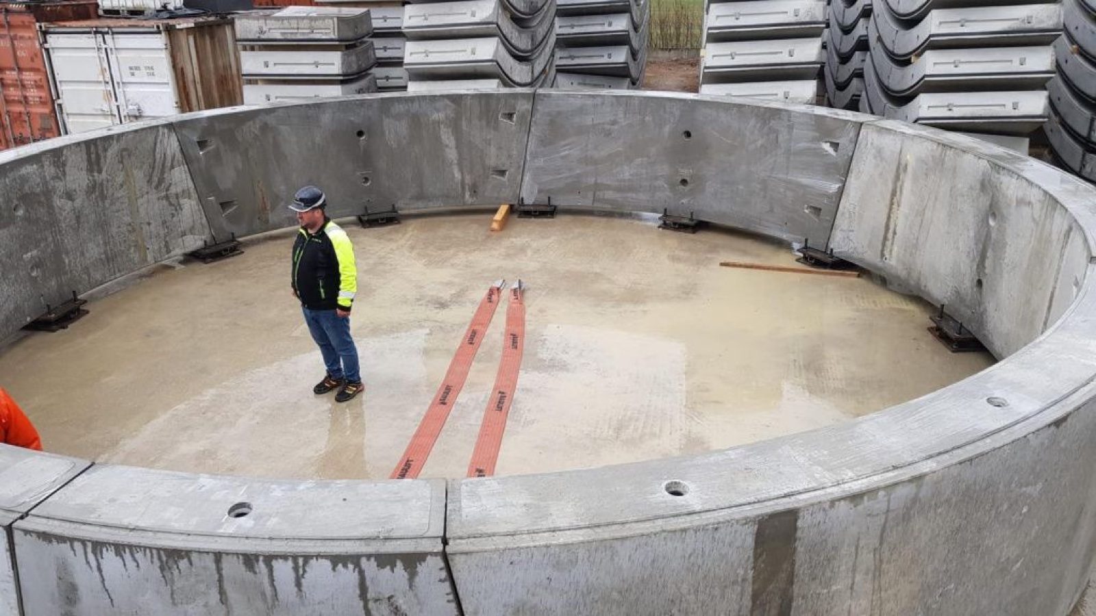 Worker inspecting a prefabricated concrete tunnel lining ring
